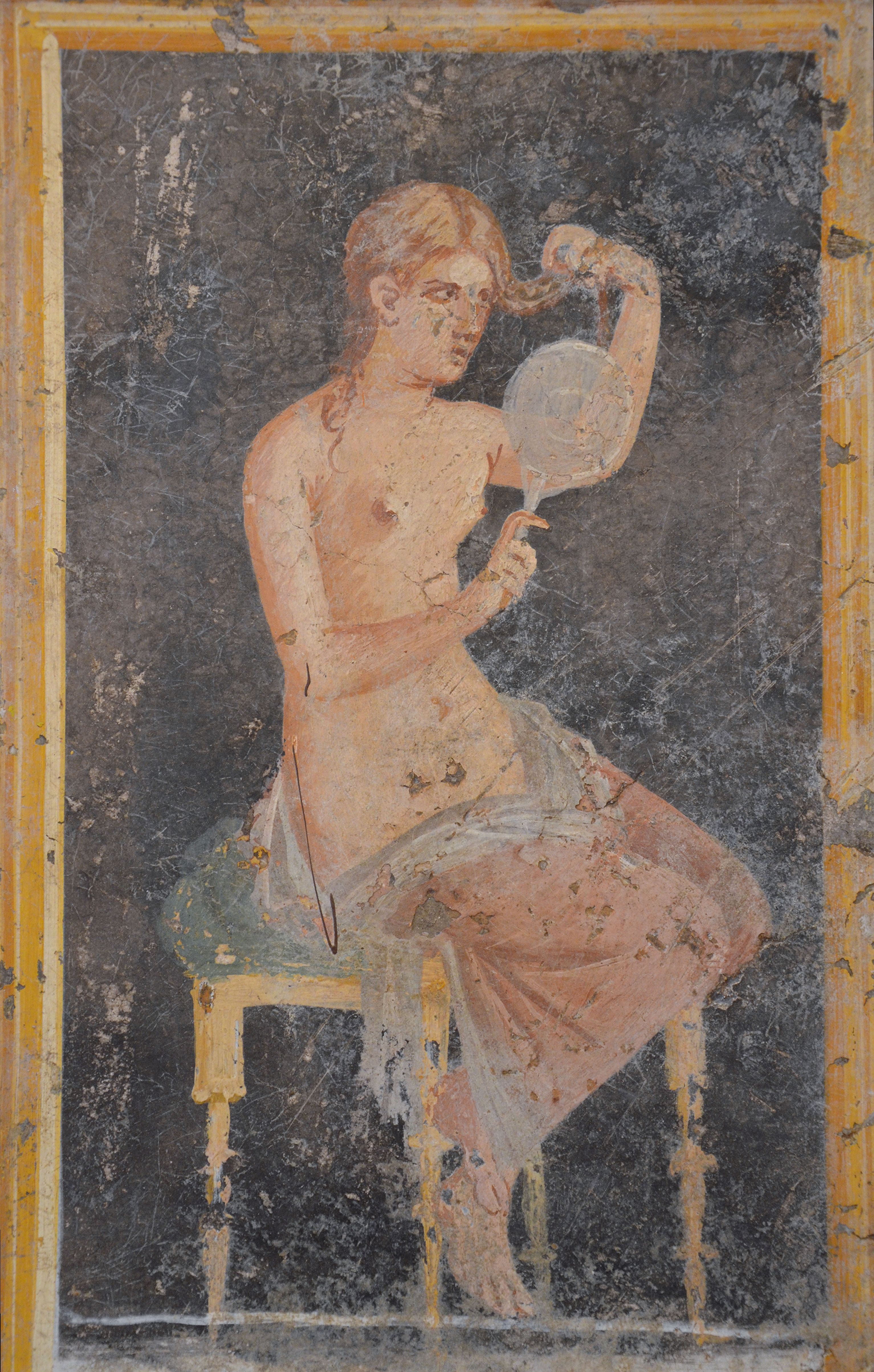 Young woman with a mirror